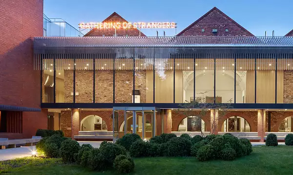 The exterior of the Whitworth Art Gallery photographed with gardens in the forefront