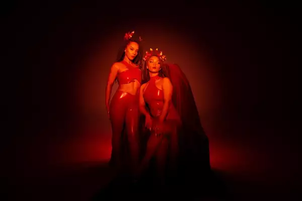 Two piece band the KTNA wear devil inspired outfits