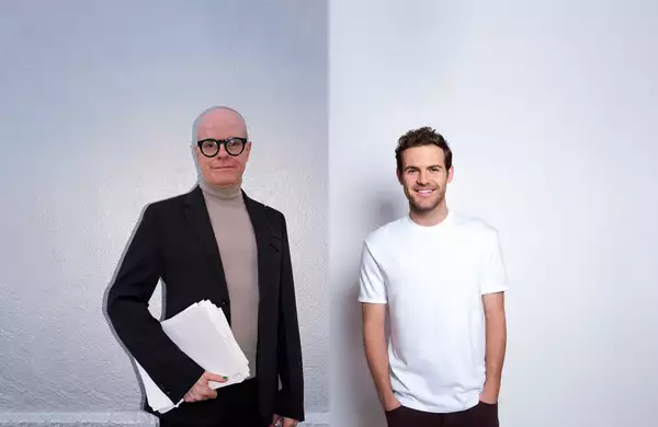 Hans Ulrich Obrist and Juan Mata in front of a white background