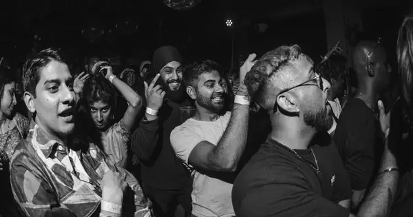 Black and White photo of group of people at a concert event