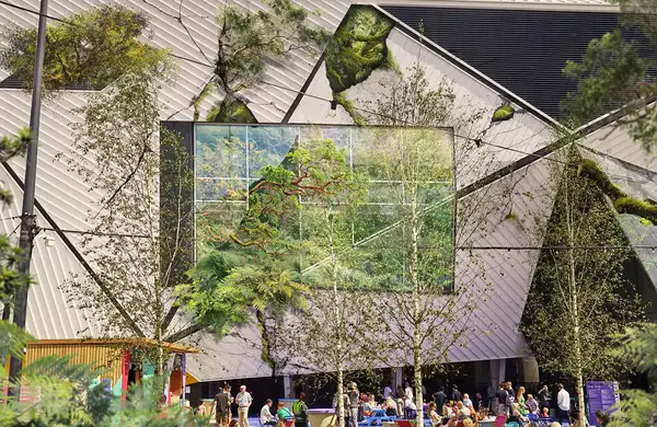 Aviva Studios x Trespass with vines and greenery covering the building