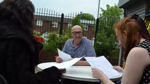 Photo of a group of people talking