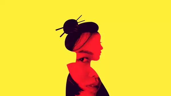 A silhouette of a woman in side profile wearing her hair in a bun with Juda sticks on a bright yellow background.