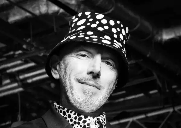 A black and white photograph of Tom Bloxham CBE by Zoe Law